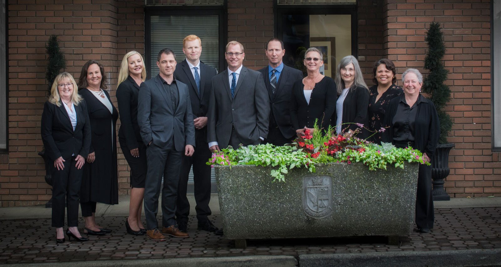 Group photo of team of lawyers and support staff at Qualicum Beach law office Marshall and Lampersons